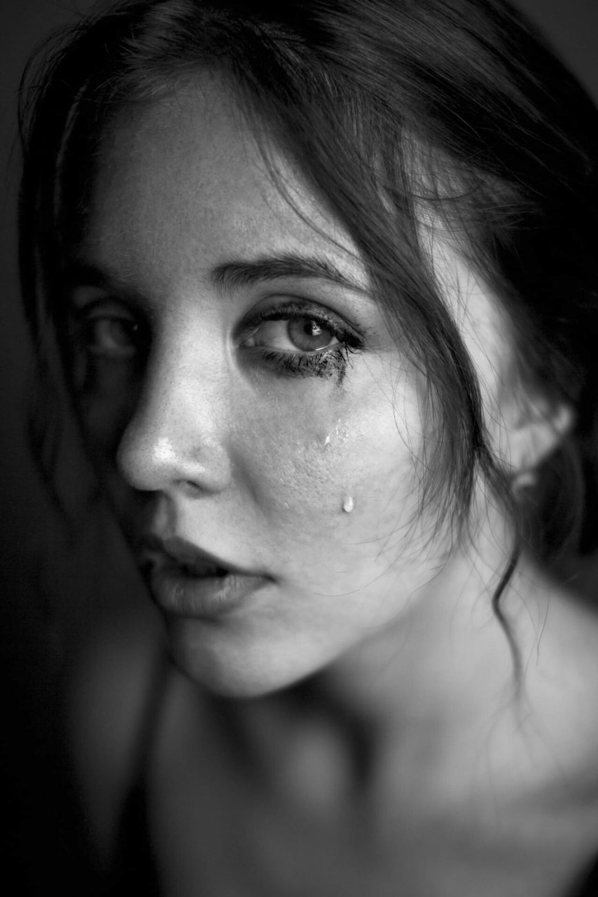 grayscale photo of womans face